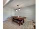 Modern dining room featuring stylish floors, light grey paint and contemporary lighting fixture above the table at 6541 Hasley Woods Dr, Huntersville, NC 28078