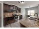 Stylish kitchen with stainless steel appliances, granite countertops, and dark wood cabinets at 6541 Hasley Woods Dr, Huntersville, NC 28078