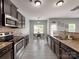 Open kitchen featuring granite countertops, stainless steel appliances, and breakfast bar at 6541 Hasley Woods Dr, Huntersville, NC 28078