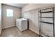 Laundry room features white washer and dryer and shelving for storage at 6541 Hasley Woods Dr, Huntersville, NC 28078