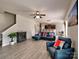 Open-concept living area boasts stylish blue seating and seamless flow to the kitchen at 6541 Hasley Woods Dr, Huntersville, NC 28078