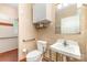 Bathroom with toilet, sink and walk-in shower with accessible features at 7587 Long Valley Dr, Harrisburg, NC 28075