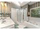 The bathroom features a soaking tub and shower, offering options for a relaxing bathing experience at 7587 Long Valley Dr, Harrisburg, NC 28075