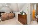 Cozy bonus room with ample storage, sofa, and natural light, perfect for relaxation and organization at 7587 Long Valley Dr, Harrisburg, NC 28075