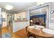 Cozy dining area with warm wood finishes, adjacent to the kitchen and living space at 7587 Long Valley Dr, Harrisburg, NC 28075
