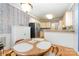 Cozy dining area with wood finishes, adjacent to the kitchen with stainless steel appliances at 7587 Long Valley Dr, Harrisburg, NC 28075