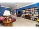 Spacious living room with a bookcase, fireplace, and hardwood floors at 7587 Long Valley Dr, Harrisburg, NC 28075