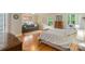 Bright bedroom featuring hardwood floors, neutral tones and natural light at 7687 Bermuda Hills Ln, Denver, NC 28037