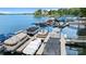 View of boat docks along lake with covered boats at 7687 Bermuda Hills Ln, Denver, NC 28037