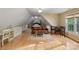 Versatile bonus room offers flexible space with a seating area and a functional desk at 7687 Bermuda Hills Ln, Denver, NC 28037