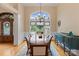 Elegant dining room with hardwood floors, large windows, and a stylish chandelier at 7687 Bermuda Hills Ln, Denver, NC 28037