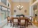 Bright dining room features large windows and classic decor at 7687 Bermuda Hills Ln, Denver, NC 28037