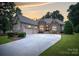 Beautiful stone and siding home with a wide driveway at 7687 Bermuda Hills Ln, Denver, NC 28037