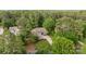 Beautiful stone and siding home surrounded by mature trees and landscaping at 7687 Bermuda Hills Ln, Denver, NC 28037