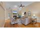 Inviting living room with fireplace, ceiling fan, and hardwood floors at 7687 Bermuda Hills Ln, Denver, NC 28037