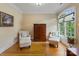 Well-lit sitting room with hardwood floors, furniture and natural light at 7687 Bermuda Hills Ln, Denver, NC 28037
