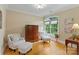 Cozy sitting room with hardwood floors, arm chairs, and natural light at 7687 Bermuda Hills Ln, Denver, NC 28037