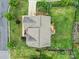 Overhead view of the house showcasing the roof, deck, and landscaped backyard with black fence at 9029 Woodview Ct, Fort Mill, SC 29707