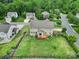 Aerial view of the home's backyard, featuring a wooden deck and a large, green lawn at 9029 Woodview Ct, Fort Mill, SC 29707