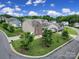 Beautiful, two-story home with brick and siding, surrounded by a lush, landscaped yard in a suburban neighborhood at 9029 Woodview Ct, Fort Mill, SC 29707