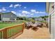 Inviting back deck featuring an outdoor lounge set and a lovely view of the yard and surrounding neighborhood at 9029 Woodview Ct, Fort Mill, SC 29707