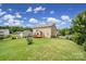 Expansive backyard featuring a well-maintained lawn, wooden deck, and partial fencing around the property at 9029 Woodview Ct, Fort Mill, SC 29707