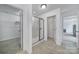 Bright bathroom featuring a tiled floor, walk-in shower, and a neutral color palette at 9029 Woodview Ct, Fort Mill, SC 29707