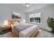 Bedroom featuring a large window, neutral tones, and comfortable decor at 9029 Woodview Ct, Fort Mill, SC 29707