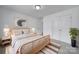 Bright bedroom featuring modern decor, neutral tones, and a cozy rug at 9029 Woodview Ct, Fort Mill, SC 29707