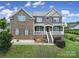 Charming two-story brick home with a welcoming front porch and well-maintained lawn at 9029 Woodview Ct, Fort Mill, SC 29707