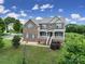 Lovely two-story brick home with a welcoming front porch and manicured landscaping at 9029 Woodview Ct, Fort Mill, SC 29707