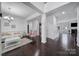 Welcoming foyer with dark wood floors, bright white trim, an elegant chandelier, and seamless access to living spaces at 9029 Woodview Ct, Fort Mill, SC 29707
