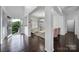 Bright foyer with an elegant chandelier, dark wood floors, and seamless transition to the living areas and a front door view at 9029 Woodview Ct, Fort Mill, SC 29707