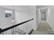 Well-lit hallway with carpet, overhead lighting and white walls at 9029 Woodview Ct, Fort Mill, SC 29707