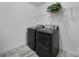 Laundry room featuring modern appliances and storage shelves at 9029 Woodview Ct, Fort Mill, SC 29707