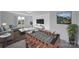 Spacious living room with a foosball table and large windows at 9029 Woodview Ct, Fort Mill, SC 29707