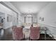 Bright living room with stylish furnishings, including plush white couches, elegant accents, and an open layout leading to the foyer at 9029 Woodview Ct, Fort Mill, SC 29707