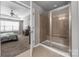 Ensuite bathroom with tiled shower, glass door, and access from the main bedroom at 9159 Marasol Ln, Concord, NC 28027