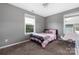 Bedroom with a large window, neutral decor, and comfortable chair at 9159 Marasol Ln, Concord, NC 28027