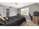 Bedroom featuring a large window, carpet and neutral paint at 9159 Marasol Ln, Concord, NC 28027