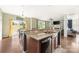 Bright kitchen with granite countertops and an adjacent dining area and living room with plenty of natural light at 9159 Marasol Ln, Concord, NC 28027