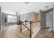 Bright living room features wood floors, large windows, and a comfortable seating area at 9159 Marasol Ln, Concord, NC 28027