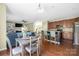Bright dining room with an open layout into the kitchen and living room and a sliding glass door to the backyard at 9159 Marasol Ln, Concord, NC 28027