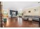 Spacious living room featuring hardwood floors, neutral paint, large windows, and elegant furnishings at 9159 Marasol Ln, Concord, NC 28027
