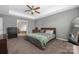 Spacious main bedroom features a tray ceiling, large window, and an ensuite bathroom at 9159 Marasol Ln, Concord, NC 28027