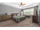 Spacious main bedroom features a tray ceiling, large window, and neutral decor at 9159 Marasol Ln, Concord, NC 28027