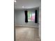 Neutral room with tiled floor, window, and natural light at 925 Grace Ave, Lancaster, SC 29720