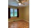 Bright bedroom featuring wood floors, natural light, and a ceiling fan at 925 Grace Ave, Lancaster, SC 29720
