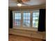 Bedroom featuring wood floor, a window with built-in shelves and drawers at 925 Grace Ave, Lancaster, SC 29720