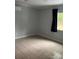 Neutral room with tiled floor, window, and mini-split AC unit at 925 Grace Ave, Lancaster, SC 29720